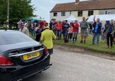 A large group meeting the Combwich Queen