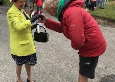 A man bowing to the Combwich Queen